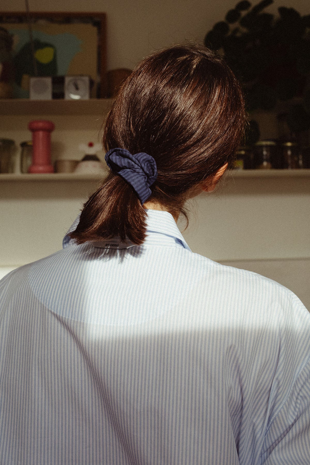 Girl with ponytail, wearing scrunchie in midnight navy check 