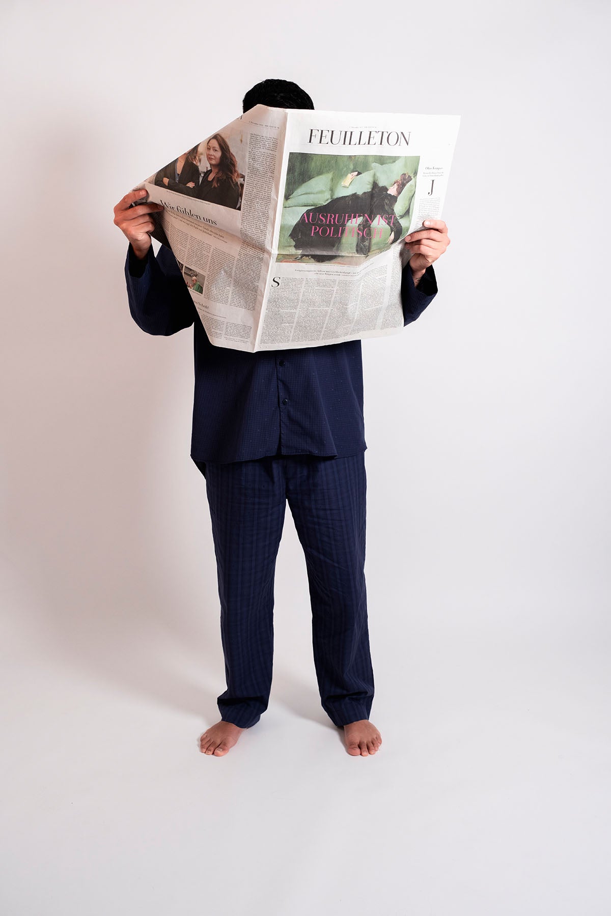 Man in Pyjama reading the newspaper